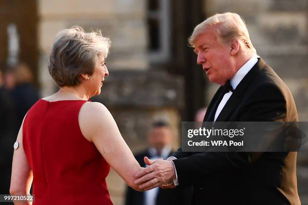 Britain's Prime Minister Theresa May greets U.S. President Donald Trump at Blenheim Palace on July 12, 2018 in Woodstock, England. Blenheim Palace is...