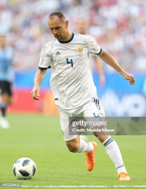 June 25: Sergey Ignashevich of Russia in action during the 2018 FIFA World Cup Russia group A match between Uruguay and Russia at Samara Arena on...