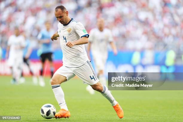 June 25: Sergey Ignashevich of Russia in action during the 2018 FIFA World Cup Russia group A match between Uruguay and Russia at Samara Arena on...
