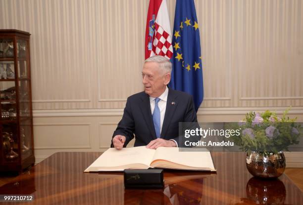 Secretary of Defense James Mattis signs a guest book during his visit to Zagreb, Croatia at Croatian Parliament on July 12, 2018.