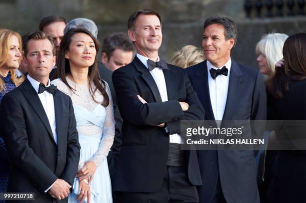 Britain's Foreign Secretary Jeremy Hunt is seen among the guests waiting for the arrival of US President Donald Trump and US First Lady Melania Trump...