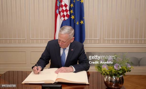 Secretary of Defense James Mattis signs a guest book during his visit to Zagreb, Croatia at Croatian Parliament on July 12, 2018.
