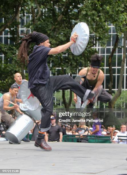 Marivaldo Dos Santos and Ivan Salazar from the cast of "STOMP" performs at 106.7 LITE FM's Broadway In Bryant Park at Bryant Park on July 12, 2018 in...