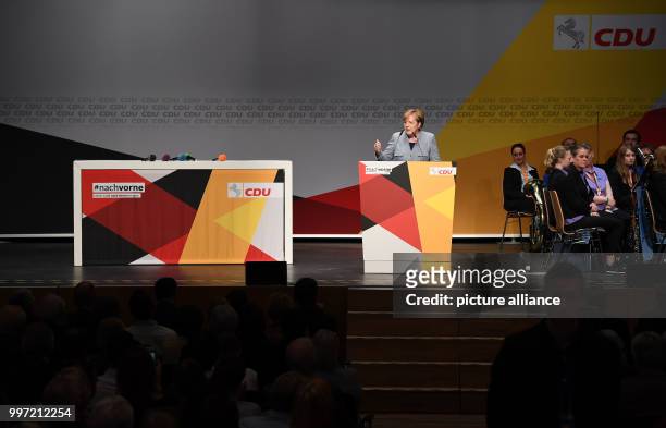 German Chancellor Angela Merkel speaks at an CDU election campaign event in the German state Lower Saxony in Stade, Germany, 13 October 2017. Photo:...