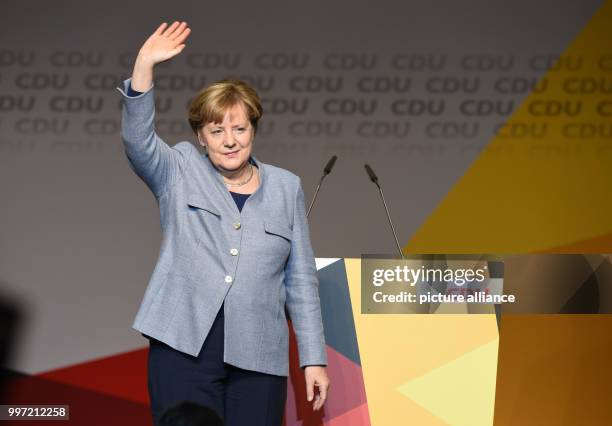 German Chancellor Angela Merkel thanks her supporters at an CDU election campaign event in the German state Lower Saxony in Stade, Germany, 13...