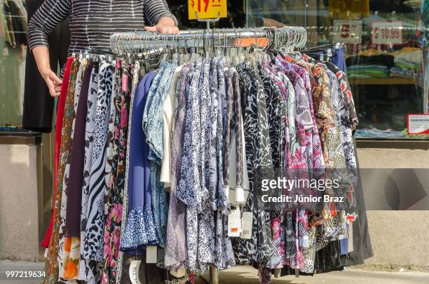 clothing store in the new pedestrian sundays celebration - sundays stock pictures, royalty-free photos & images