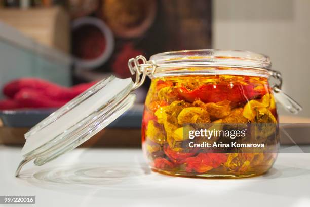 dried tomatoes in glass jar - arina stock pictures, royalty-free photos & images