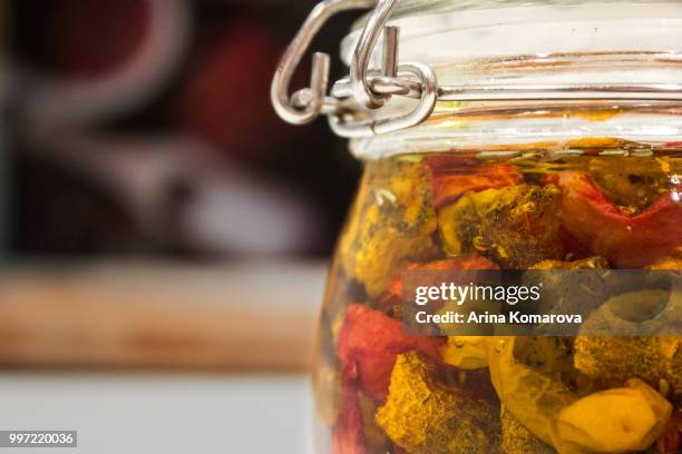 dried tomatoes in glass jar - arina stock pictures, royalty-free photos & images