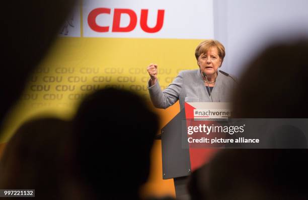 German Chancellor Angela Merkel speaks at an campaign event in Osnabrueck, Germany, 13 October 2017. The election for a new regional parliament in...