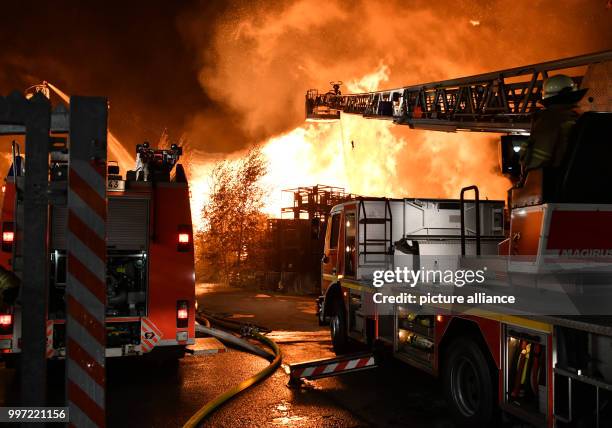 Firefighters try to control a fire in Alt-Hohenschoenhausen, a part of Berlin, Germany, 13 October 2017. About 80 firefighters are involved. Photo:...