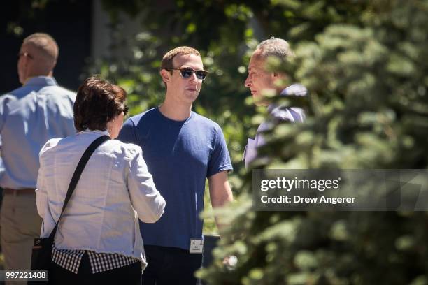 Mark Zuckerberg, chief executive officer of Facebook, talks with Senate Minority Leader Chuck Schumer during the annual Allen & Company Sun Valley...