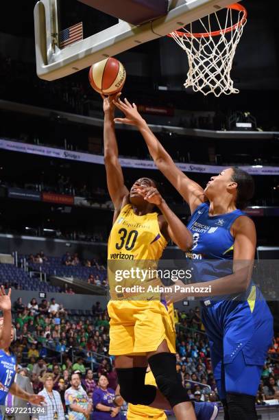 Nneka Ogwumike of the Los Angeles Sparks and Elizabeth Cambage of the Dallas Wings compete for the ball on July 12, 2018 at STAPLES Center in Los...