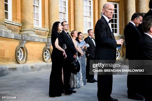 First lady Melania Trump's chief of staff Lindsay Reynold and first lady's Press Secretary Stephanie Grisham are seen among the guests attending a...