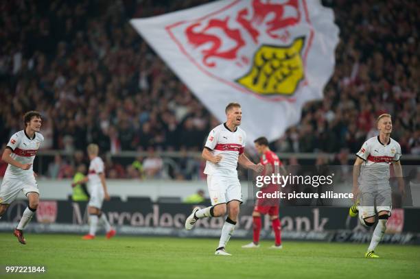 Stuttgart's Benjamin Pavard , Simon Terodde and Timo Baumgartl celebrate after the winning 2-1 goal during the Bundesliga soccer match VfB Stuttgart...