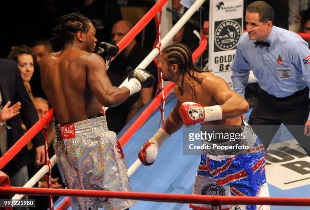 Audley Harrison recoils after a punch from David Haye during the WBA Heavyweight Title Fight named the "Battle of Britain" at the MEN Arena on...