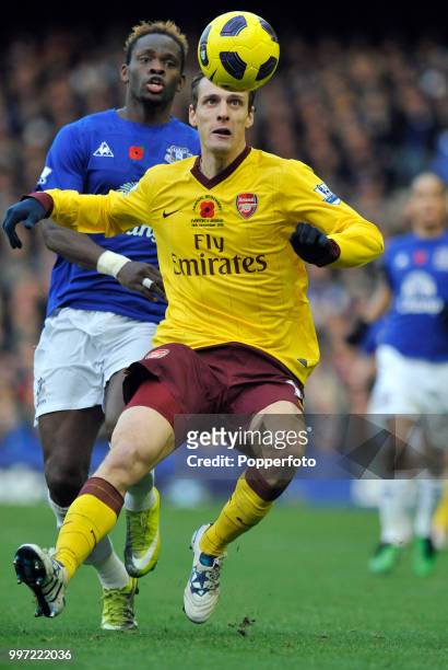 Sebastien Squillaci of Arsenal is closed down by Louis Saha of Everton during a Barclays Premier League match at Goodison Park on November 14, 2010...