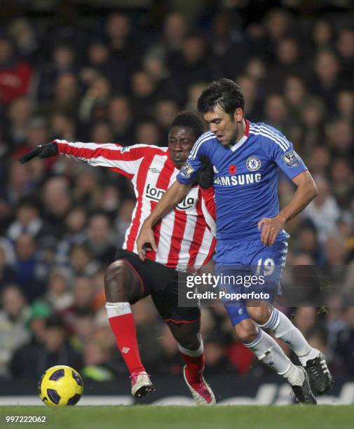 Asamoah Gyan of Sunderland battles with Paulo Ferreira of Chelsea during a Barclays Premier League match at Stamford Bridge on November 14, 2010 in...
