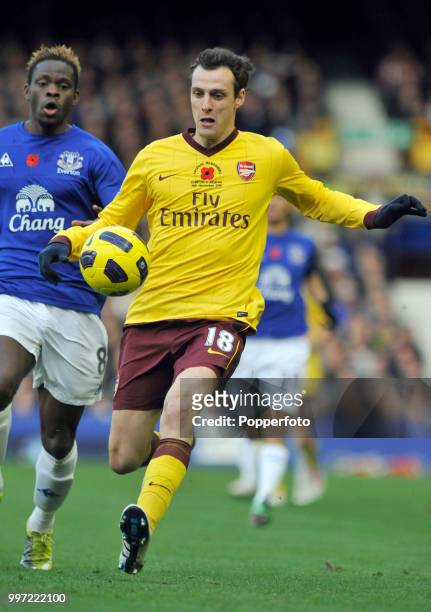 Sebastien Squillaci of Arsenal is chased by Louis Saha of Everton during a Barclays Premier League match at Goodison Park on November 14, 2010 in...