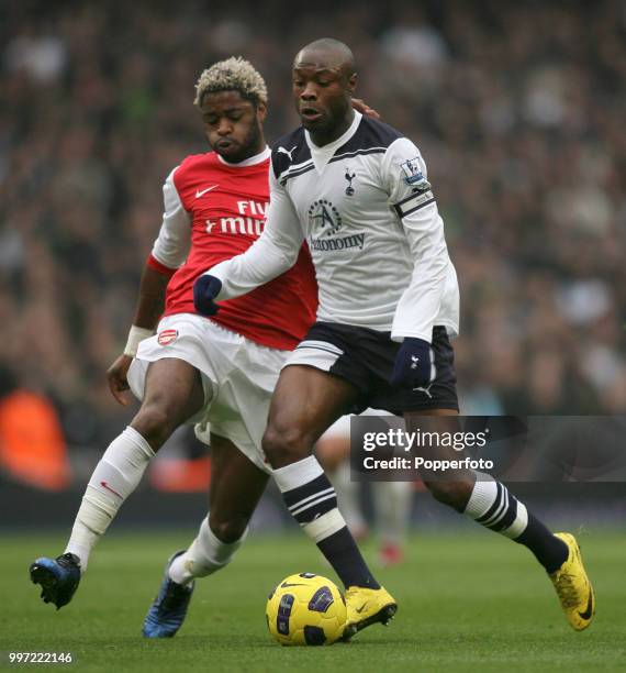William Gallas of Tottenham Hotspur is tackled by Alex Song of Arsenal during a Barclays Premier League match at the Emirates Stadium on November 20,...