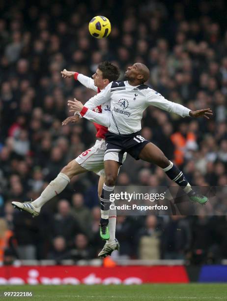 Laurent Koscielny of Arsenal battles with Jermain Defoe of Tottenham Hotspur during a Barclays Premier League match at the Emirates Stadium on...