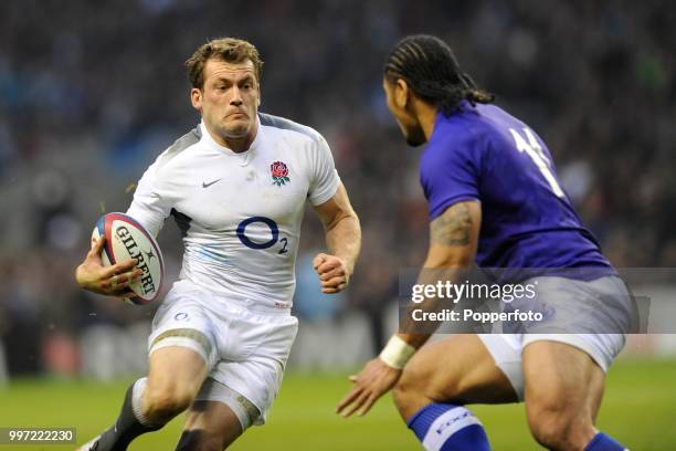 Mark Cueto of England is faced by Alesana Tuilagi of Samoa during the Investec International match between England and Samoa at Twickenham Stadium on...