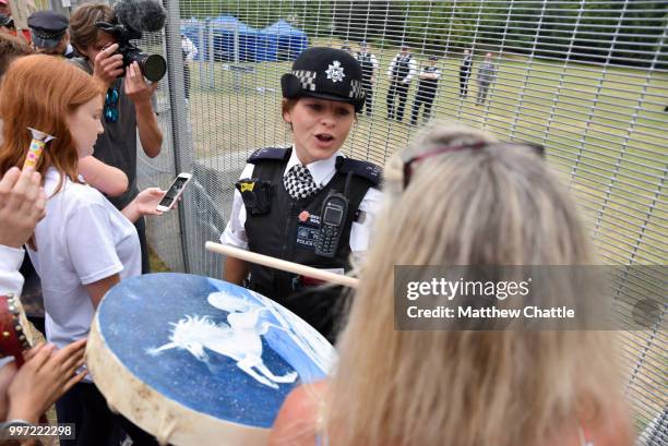 Protesters standing outside the Regent's Park residence of the US Ambassador as the President prepares to leave for Blenheim Palace.PHOTOGRAPH BY...