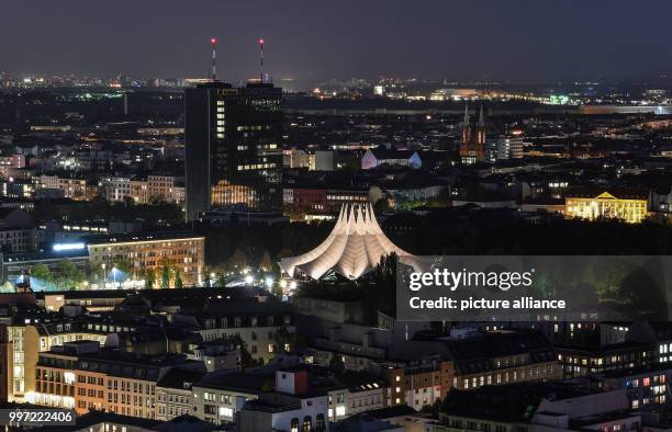 The roof of the Tempodrom is brightly lit during the evening with the Postbank tower to be seen in the background in Berlin, Germany, 13 October,...