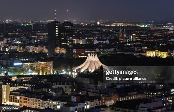 The roof of the Tempodrom is brightly lit during the evening with the Postbank tower to be seen in the background in Berlin, Germany, 13 October,...