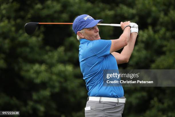 Elaine Crosby plays a tee shot on the first hole during the first round of the U.S. Senior Women's Open at Chicago Golf Club on July 12, 2018 in...