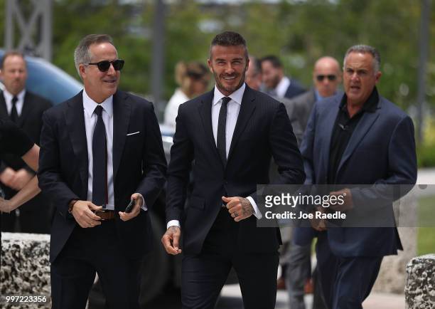 Jorge Mas and David Beckham arrive for a rally being held next to Miami City Hall in support of building a Major League Soccer stadium on July 12,...