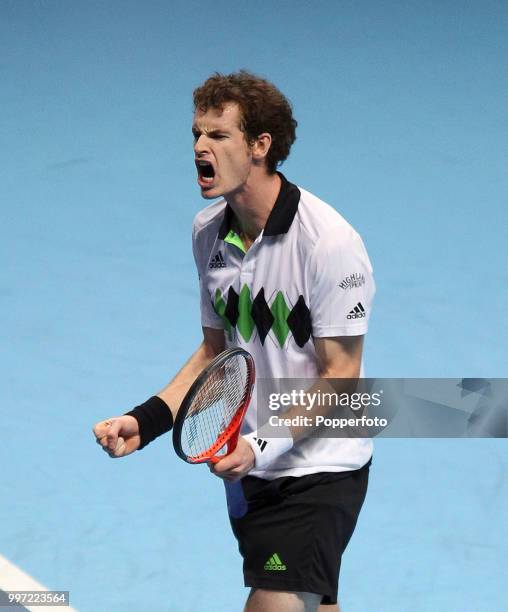 Andy Murray of Great Britain reacts during his match against David Ferrer in the Barclays ATP World Tour Finals round robin match at the O2 Arena on...