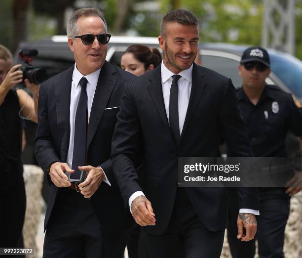 Jorge Mas and David Beckham arrive for a rally being held next to Miami City Hall in support of building a Major League soccer stadium on July 12,...