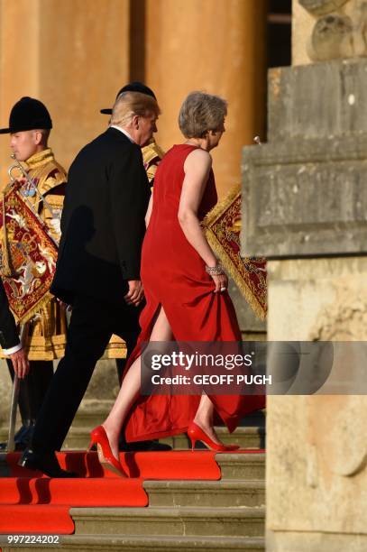 Britain's Prime Minister Theresa May talks with US President Donald Trump as she welcomes him for a black-tie dinner with business leaders at...