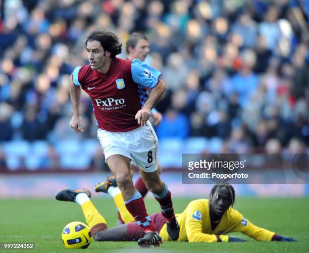Robert Pires of Aston Villa gets away from Bacary Sagna of Arsenal during a Barclays Premier League match at Villa Park on November 27, 2010 in...