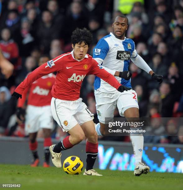 Park Ji-sung of Manchester United gets away from Herold Goulon of Blackburn Rovers during a Barclays Premier League match at Old Trafford on November...