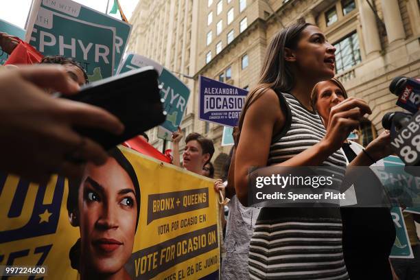 Congressional nominee Alexandria Ocasio-Cortez stands with Zephyr Teachout after endorsing her for New York City Public Advocate on July 12, 2018 in...