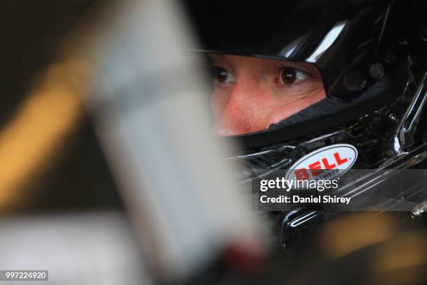 Paul Menard, driver of the Discount Tire Ford, sits in his car during practice for the NASCAR Xfinity Series Alsco 300 at Kentucky Speedway on July...