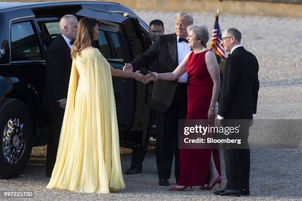 Theresa May, U.K. Prime minister, second right, greets U.S. First lady Melania Trump, left, while U.S. President Donald Trump, and Philip May,...