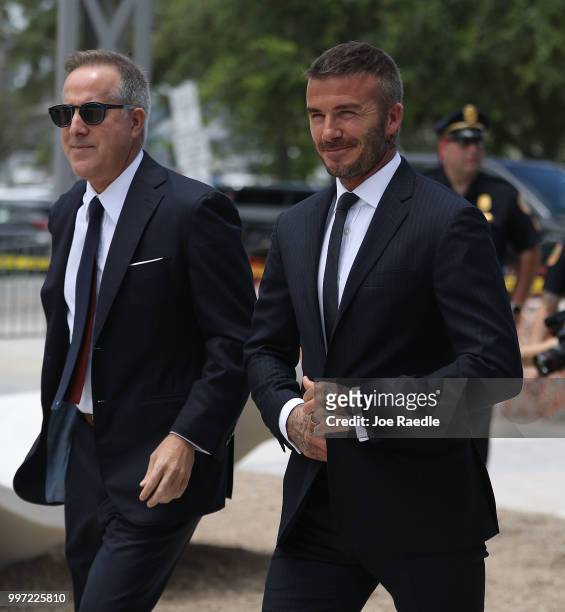 Jorge Mas and David Beckham arrive for a rally being held next to Miami City Hall in support of building a Major League soccer stadium on July 12,...