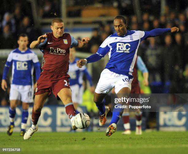 Cameron Jerome of Birmingham City and Luke Young of Aston Villa battle for the ball during an Carling Cup Quarter Final at St Andrews on December 1,...