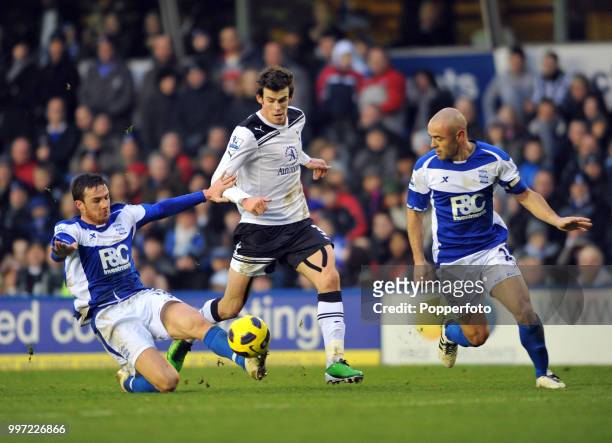 Barry Ferguson and Stephen Carr of Birmingham City challenge Gareth Bale of Tottenham Hotspur during a Barclays Premier League match at St Andrews on...