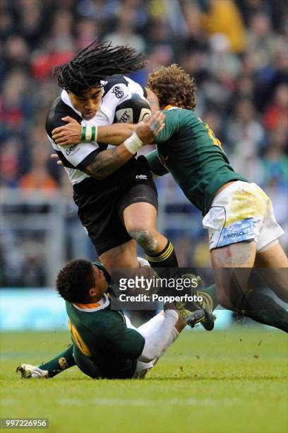 Ma'a Nonu of the Barbarians is tackled by Elton Jantjies and Andries Strauss of South Africa during the Mastercard Trophy match between the...