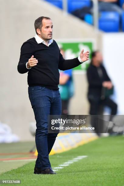 Augsburg's coach Manuel Baum gesticulating during the German Bundesliga soccer match between 1899 Hoffenheim and FC Augsburg at the Rhein Neckar...