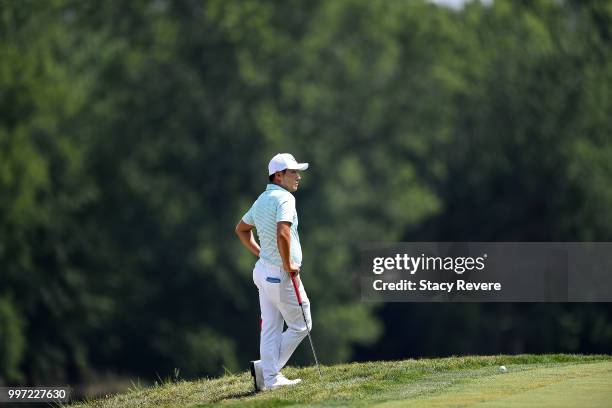 Sung Kang of Korea waits to putt on the 16th green during the first round of the John Deere Classic at TPC Deere Run on July 12, 2018 in Silvis,...