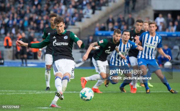 Schalke's Leon Goretzka in action against Hertha's goalkeeper Rune Jarstein as he scores the 1-0 goal during the German Bundesliga soccer match...