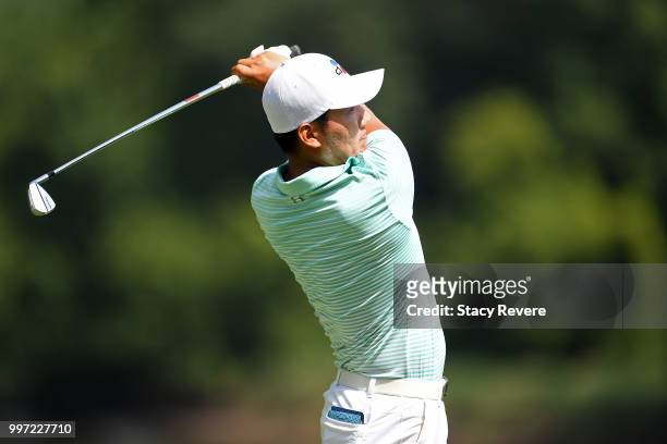 Sung Kang of Korea hits his tee shot on the 16th hole during the first round of the John Deere Classic at TPC Deere Run on July 12, 2018 in Silvis,...