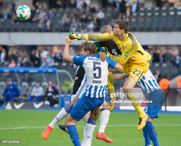 Hertha's goalkeeper Rune Jarstein and his colleague Niklas Stark in action against Schalke's Naldo during the German Bundesliga soccer match between...