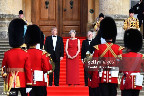 President Donald Trump, from left, Theresa May, U.K. Prime minister, and her husband Philip May watch a live military performance by the bands of the...