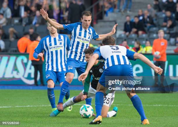 Hertha's Vladimir Darida causes Schalke's Amine Harit to fall in the penalty area, leading to a penalty shooting for Schalke, during the German...