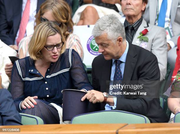 Amber Rudd and Russell Chambers attend day ten of the Wimbledon Tennis Championships at the All England Lawn Tennis and Croquet Club on July 12, 2018...